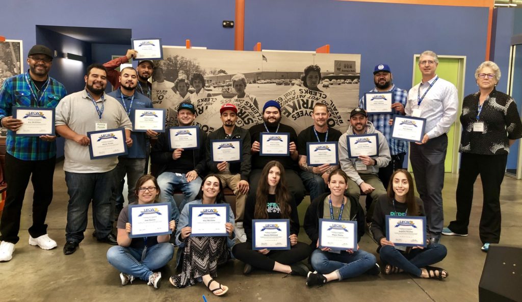 Attendees to the Cannabis OSHA Trainings at UFCW Local 770 hold up their training certificates