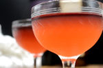A layered cocktail in an old-fashioned glass