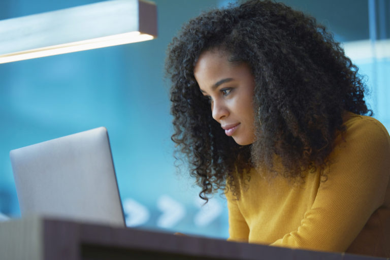 young woman on laptop in office