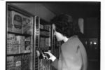 Black and white photo of a woman shopping at Keedoozle